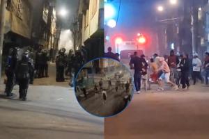 Capturas de pantalla de diferentes videos que muestran un enfrentamiento entre encapuchados y la Undmo en Bilbao, Suba.