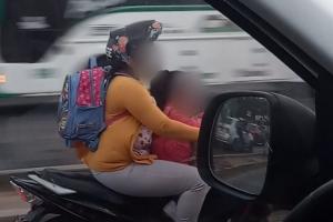 Sorprendimos a esta mujer con niña menor de edad en moto