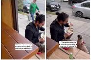 hombre y perro afuera de un restaurante