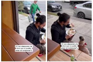 hombre y perro afuera de un restaurante