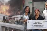 Un año después del incendio en la calle 19, comerciantes reciben la ayuda prometida